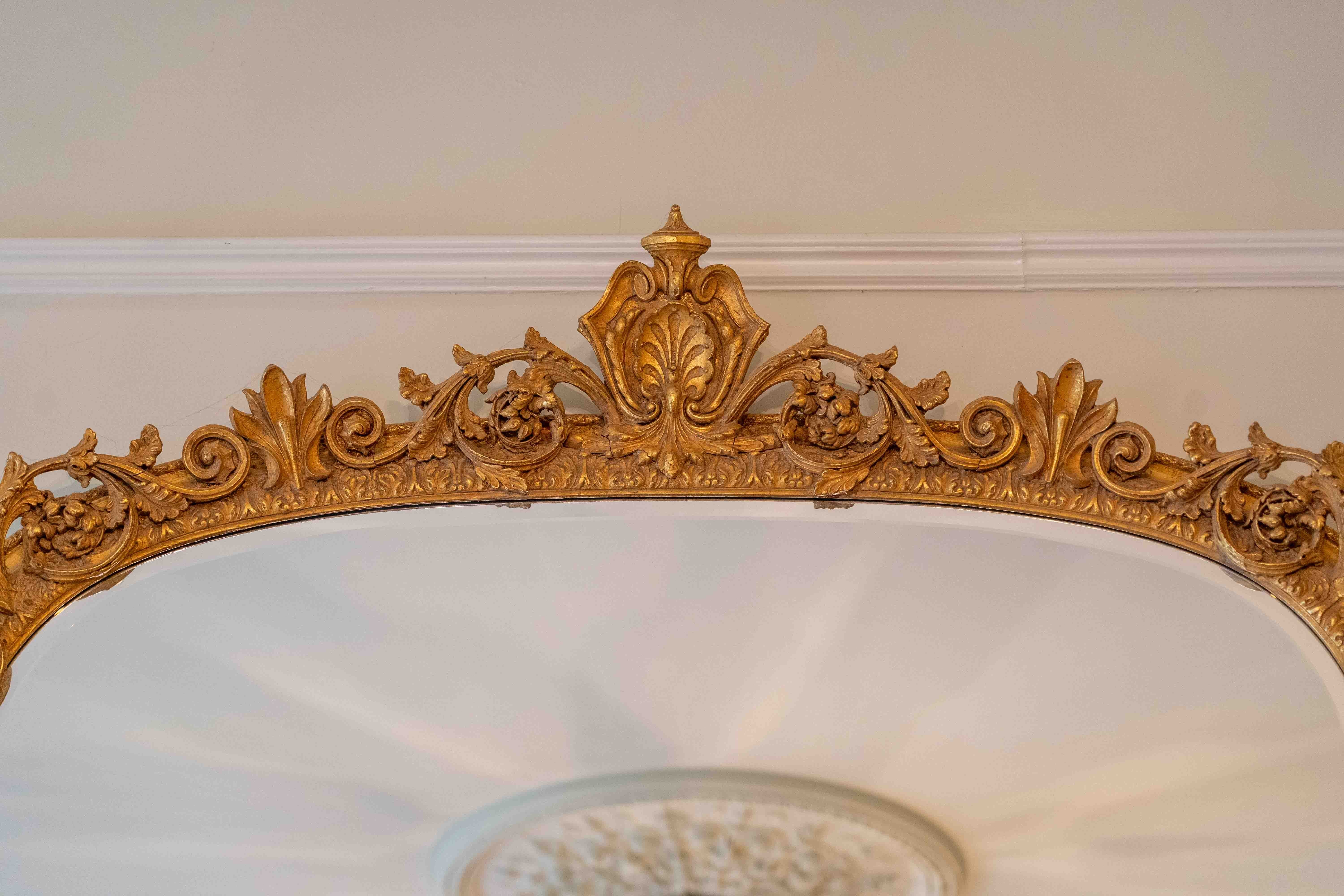 A Victorian style giltwood and composition overmantel mirror, width 138cm, height 180cm. Condition - good